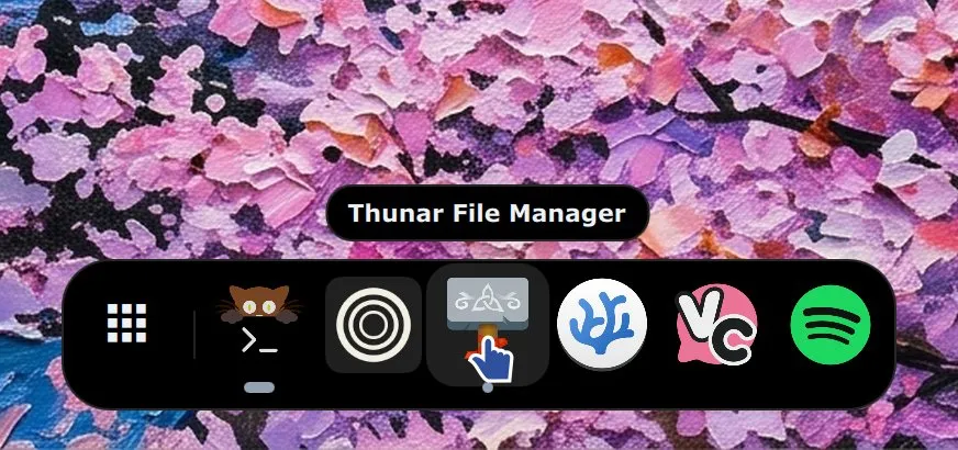 The dock with the pointer over Thunar and its name shown above the icon.