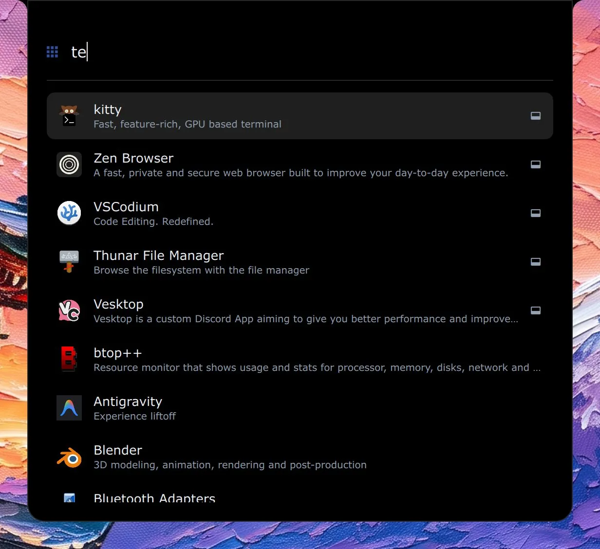 The launcher with te typed and a list of applications led by kitty, Zen Browser, VSCodium, Thunar and Vesktop.
