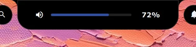 The island as a narrow bar with a speaker symbol, a volume slider and 72%.