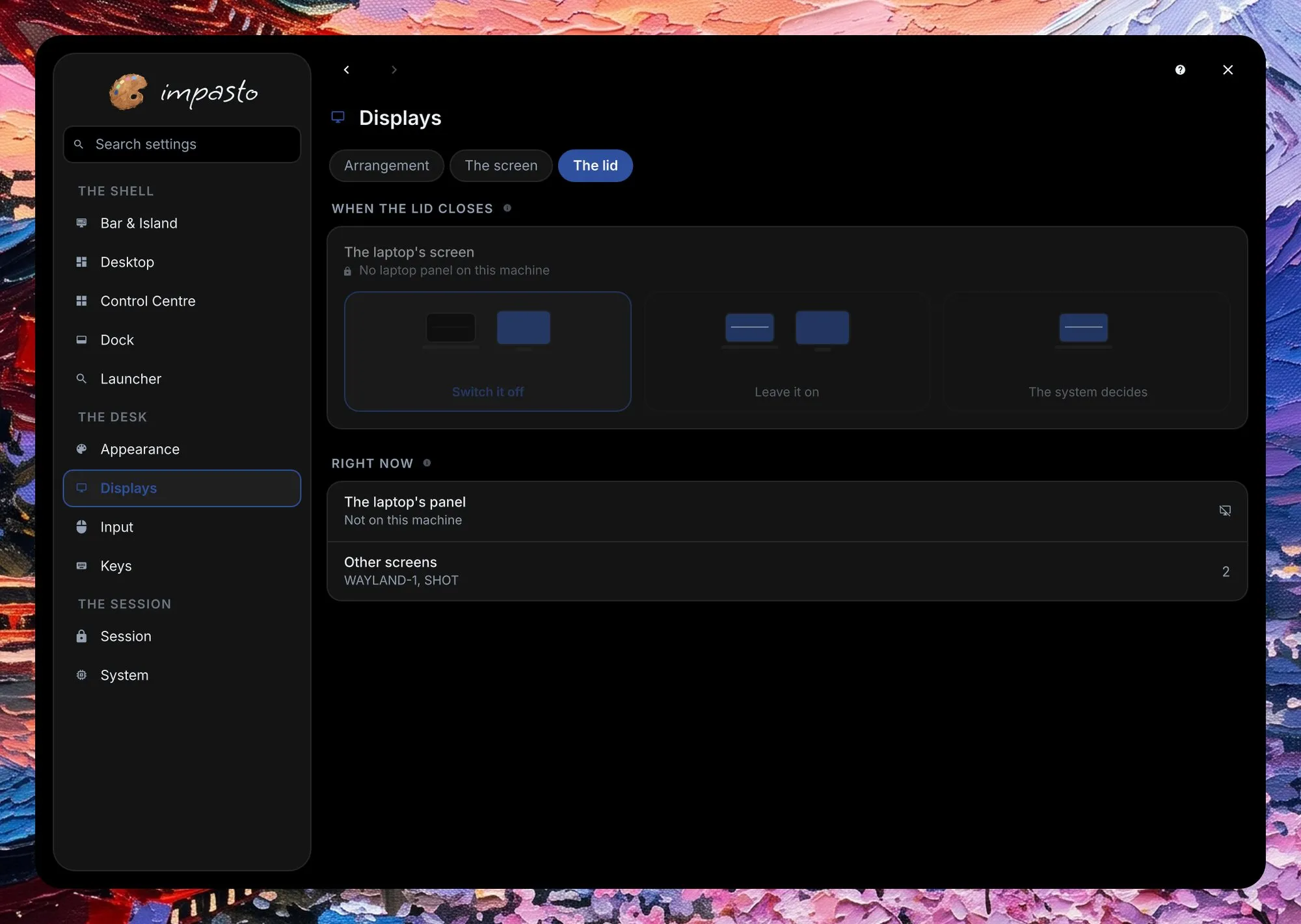 The settings window on the Displays page, with the sidebar on the left; the page is on The lid: what the laptop's screen does when the lid closes, and the screens connected right now.